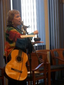Cheryl Melody singing with Tibetan singing bowl.